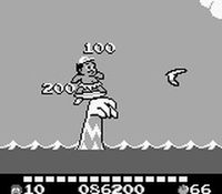 une photo d'Ã©cran de Adventure Island 2 - Aliens in Paradise sur Nintendo Game Boy